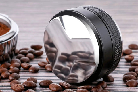 53mm Coffee Distributor And Tamper With Dual Head Leveler For 54mm Portafilter Baskets next to coffee beans