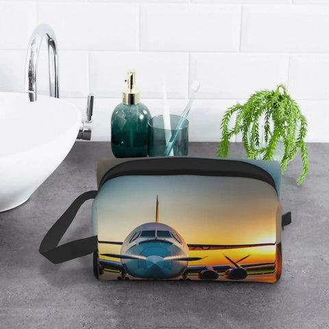 Aircraft at Sunsets Print Dopp Kit Travel Cosmetic Bag for Makeup and Toiletries on bathroom counter with plant and toiletries