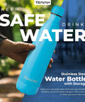 Person holding a blue dual chamber water bottle with hidden storage stash compartment insulated double walled stainless steel tumbler 17oz matte black leak proof for travel and home everyday use outdoors.