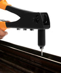 Heavy Duty Hand Rivet Gun Kit With Four Rivet Sizes 3/32 In 1/8 In 5/32 In And 3/16 In Includes 100 Rivets And Four Replaceable Heads Durable Metal Construction For Metal Plastic And Leather Easy Squeeze Handle For Fast Secure Riveting in use on a metal surface