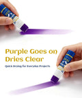 Applying All Purpose Office Glue Sticks 6g Pack Of 30 Purple Goes On Dries Clear showing purple line on white paper
