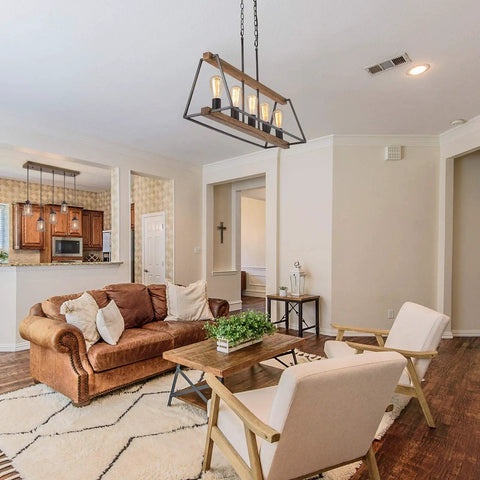 Farmhouse Vibe 5-Light Chandelier For Dining Room And Kitchen Island, Rustic Metal Frame With Open Cage Design in living room