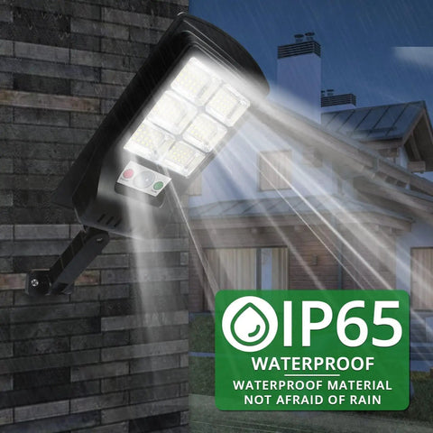 Outdoor Solar Lights 4 Pack 1000 Lumens Motion Sensor Security Flood Lights Waterproof IP65 mounted on exterior wall in rain