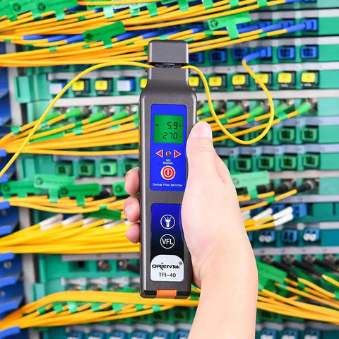 Person using All In One Optical Fiber Identifier With 10 mW VFL And 800 To 1700 Nanometers Fiber Detector in network room