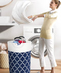 Woman using Large Collapsible Laundry Basket With Tall Aluminum Soft Grip Handles Waterproof Hamper 75L Capacity in laundry room