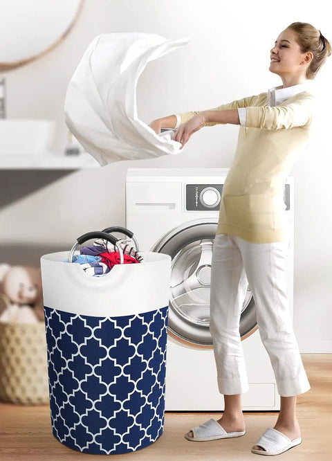 Woman using Large Collapsible Laundry Basket With Tall Aluminum Soft Grip Handles Waterproof Hamper 75L Capacity in laundry room