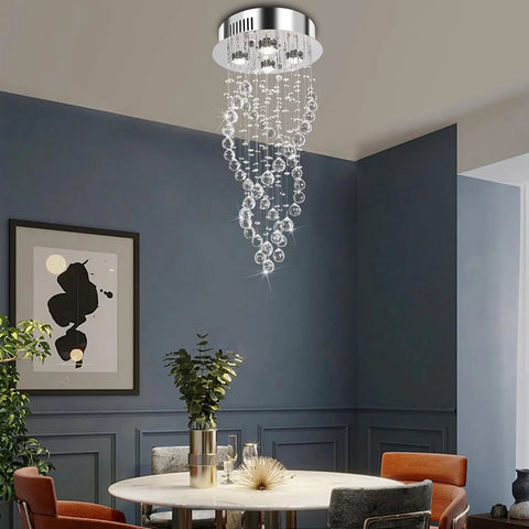 Modern Spiral Raindrop Crystal Chandelier Three Light Flush Mount Ceiling Fixture With K9 Crystal Orbs in a dining room setting