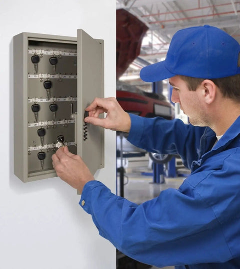 Man using Heavy Duty 16 Gauge Wall Mount Key Locker With 60 Key Capacity, Over 1,000 Resettable Combinations in workshop