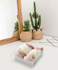 Three Piece Foldable Closet Organizer Bins With Adjustable Drawer Dividers For Socks Undies And Lingerie, holding bras in a white fabric storage cube.