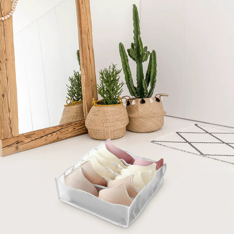 Three Piece Foldable Closet Organizer Bins With Adjustable Drawer Dividers For Socks Undies And Lingerie, holding bras in a white fabric storage cube.