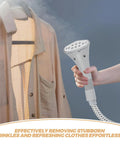 Hand using Replacement Steam Hose And Nozzle Kit For Garment Steamer With Clip Design on shirt, demonstrating wrinkle removal