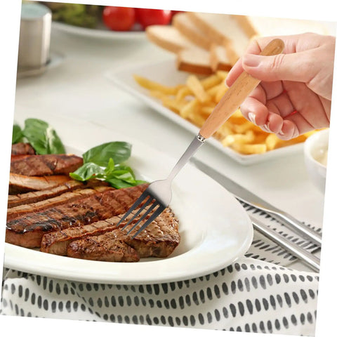A hand using a fork from the Outdoor Dining Kit Stainless Steel Camping Tableware Set with Spoons Forks and Knives for On The Go Hiking Beach and Picnic Durable Reusable Rust Resistant Dinnerware Gear.
