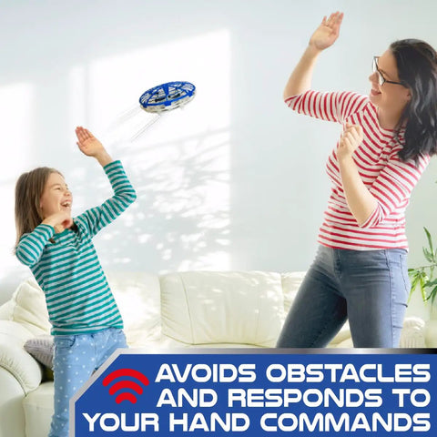 Mother and child playing with Self-Flying Aero Drone 360 For Kids With Hand Command Control indoors.