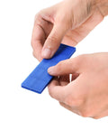 Okllen plastic flat shim, blue, held by hands (front view)