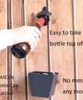Twenty Four Pack Matte Black Cast Iron Bottle Opener Wall Mounted Heavy Duty Steel Cap Remover Hanging Bar Supplies With Mounting Studs For Kitchen Pub And Game Room Built Like A Tank Setup in use, removing bottle cap.