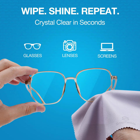 Microfiber cleaning cloths for glasses; gray cloth beside metal eyeglasses being wiped.