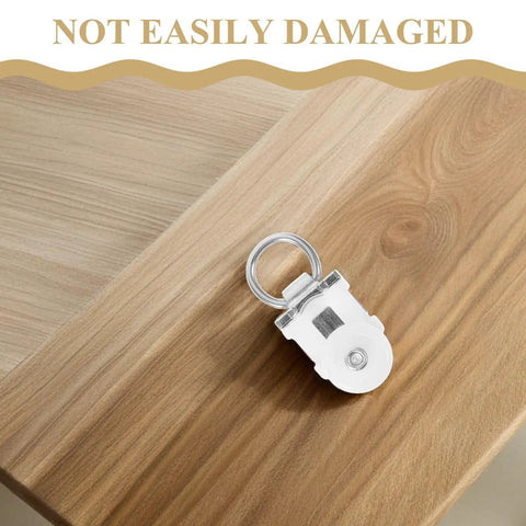Thirty Pack Of Heavy Duty Double Wheel Curtain Track Rollers Made To Slide Like Butter On Overhead Ceiling Pulleys on wooden surface.