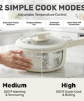All In One Electric Hot Pot With Steamer And Lid 1.5L Nonstick Ceramic Cooker boiling water on countertop