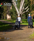 No Drama All Terrain Remote Electric Golf Cart With Full Zip Folding Frame Plays Thirty Six Holes being used by two golfers in a park.