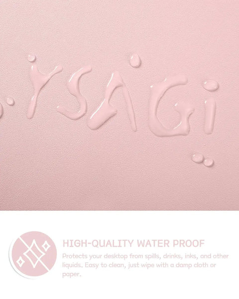 Focus on water droplets on the Pink Non Slip Leather Desk Pad With Waterproof Top For Laptop And Keyboard Large 23.6 By 13.7 Inches Anti Slip Back Suede Single Side Use Table Protector Mat And Blotter Pad For Office Home Decor