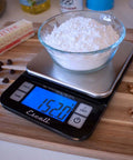 Nutro Digital Food Scale For Real Precise Weighing And Portion Control, glass bowl with flour on stainless steel platform