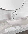 Colony Pro Single Handle Bathroom Faucet With 1.2 GPM Flow Polished Chrome on a modern countertop and backsplash