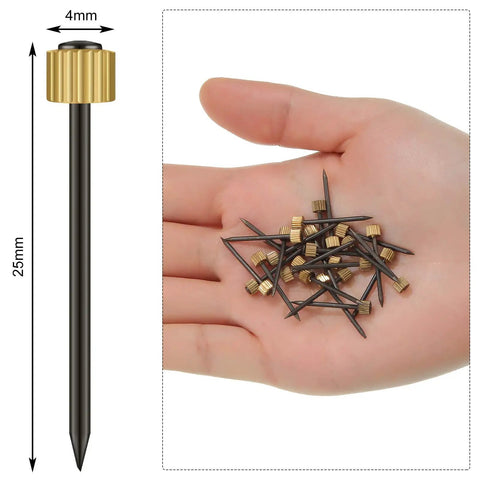 Hand holding 100 Pieces Picture Hanging Nails Set 0.16 x 0.98 Inch Wall Hanger Nails For Drywall Holds 5-30 Lbs Decorative Frame Art Hanging Hardware