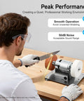 Man using Mini Bench Grinder With Adjustable Speed Table for polishing knife with dual grinding wheels.