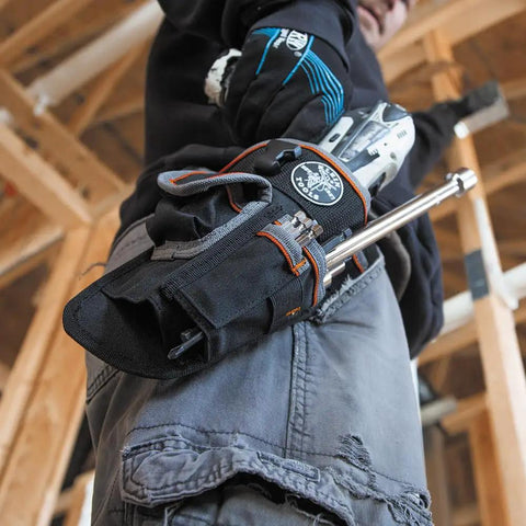 Tradesman Pro Drill Pouch with 1680D ballistic weave holding tools on a belt, ideal for job sites, fits drills and impact drivers.