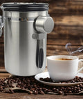 Stainless Steel Airtight Coffee Container Set With Scoop Keeps Your Daily Brew Snacks Cereal Flour Straight Up Crisp with coffee cup.