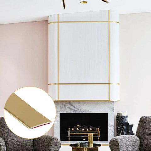 Kick Up Your Rooms With Matte Gold Peel And Stick Molding Trim on modern white wall with fireplace, shown in close-up detail.