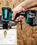 Beast 18V Brushless 1/2 Inch Driver Drill Cordless Kit With Two Speed Transmission drilling into metal sheet on job site
