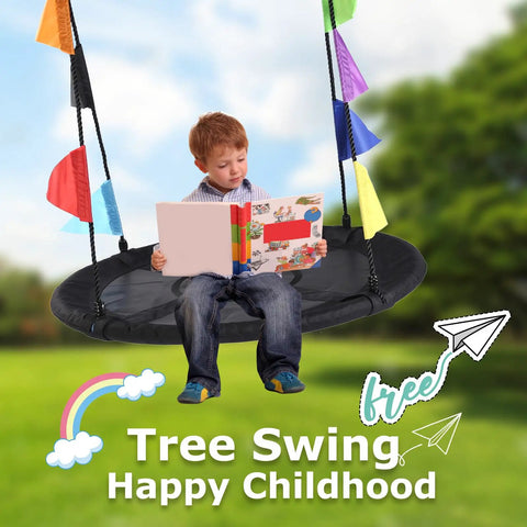 Child reading on 40 Inch Saucer Tree Swing For Kids With Heavy Duty Steel Frame Foam Padding Braided Ropes Secure Metal Rings