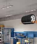Wall Mount Tire Rack With Adjustable 31 To 56 Inch Range, Heavy Duty Steel Telescopic Rods, 400 Pound Capacity, Orange installed
