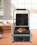 1800W Commercial Panini Press Grill Stainless Steel Electric Sandwich Maker with adjustable temperature, grilling steak on counter.