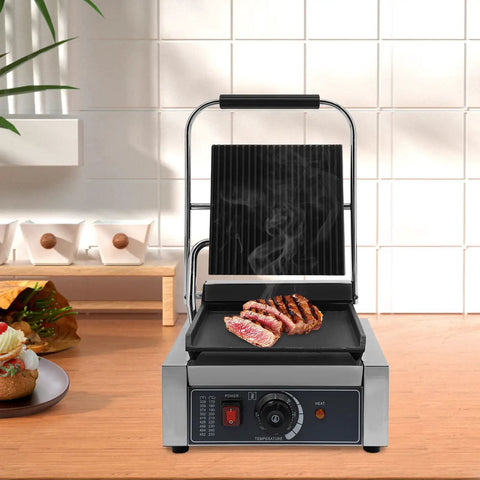 1800W Commercial Panini Press Grill Stainless Steel Electric Sandwich Maker with adjustable temperature, grilling steak on counter.