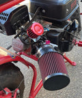 Close-up of a mounted two pack 12mm universal red cone air filter for car and motorcycle cold air intake upgrade on a bike.