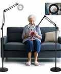 Woman knitting with 10X Magnifying Floor Lamp With Light And Stand 3 In 1 Hands Free Loupe adjustable height in living room