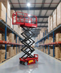 Heavy Duty Hydraulic Lift Platform Production Line Docking Table in warehouse, red scissor lift for material transfer.