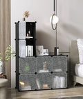 Cube Storage Organizer With Doors Eight Cube Shelves Closet Cabinet in bedroom, plastic black modular bookshelf with decor items.