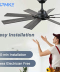 Installer positioning a black 52 Inch Ceiling Fan With Light And Remote, Reversible DC Motor, in a room