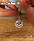 Hands tying cable tie on 3X10Ft Balcony Privacy Screen Fence Cover For Porch Deck Patio Garden Backyard UV Resistant Fence Net