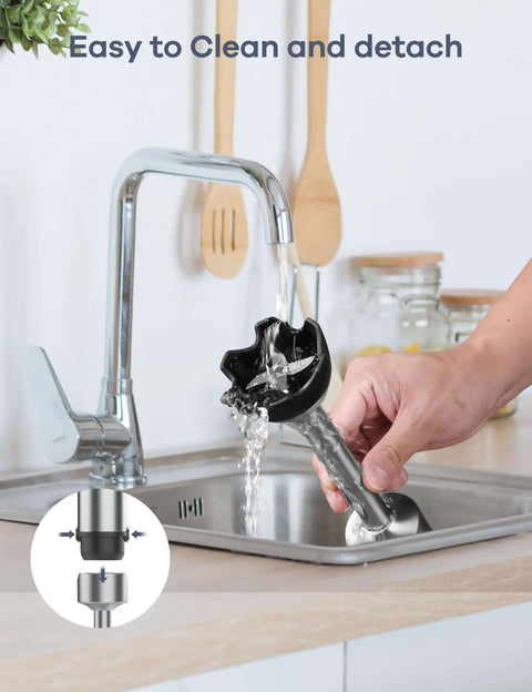 User cleaning Hella Sick Corded Immersion Blender with water under sink faucet, showcasing easy detachment and stainless steel.