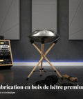 Badass Heavy Duty Portable Foldable Drum Rack Crafted From Premium Beech Wood Tripod Stand with steel drum on studio floor.