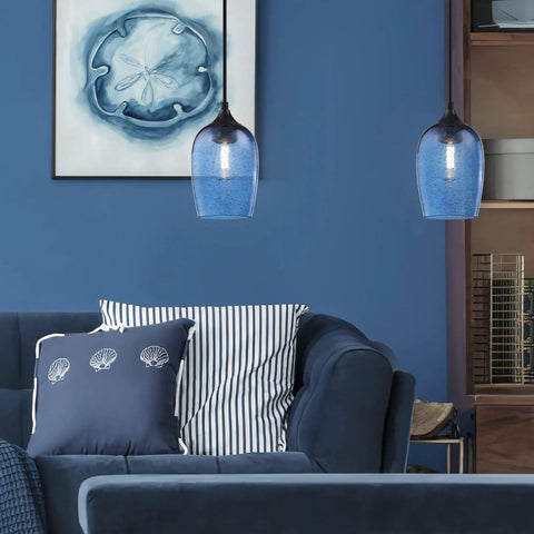 Three Pack Pendant Lights Set for Kitchen Island Hand Blown Seeded Blue Glass Shades in Black Finish above a blue sofa