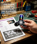 Hand holding assembled Beginner-Friendly Soldering Practice Kit With 3 Leaves Fidget Spinner Project LED Flasher Light DIY Electronics Board STEM Soldering Kit For Hobbyists Engineers And Students over instruction manual on workbench.