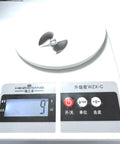Beefed-Up 4mm Metal Propeller Upgrade For UDI Arrow RC Boats on digital scale showing weight