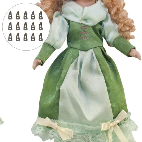 Doll wearing green dress with 100Pc Mini Buttons For Doll Clothes DIY Fasteners Kit, shown as tiny black button options.