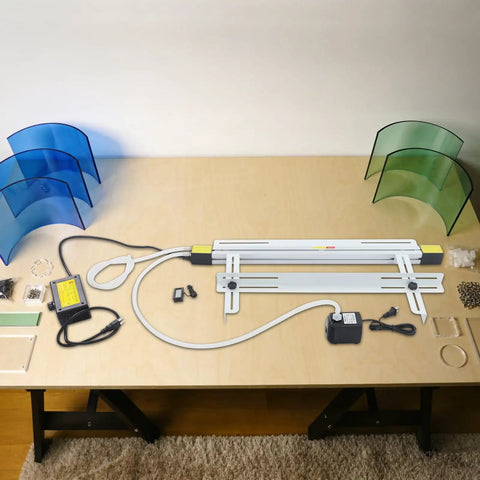 24 Inch 1000W Acrylic Heat Bending Machine With Water Cooling For Plexiglass Plastic setup with blue and green sheets on a workbench.