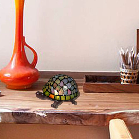 Turtle Accent Lamp With Vintage Stained Glass Look on wooden table, handcrafted copper foil, bronze finish, colorful glass pieces.